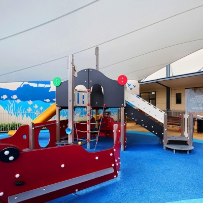 Waterproof shade sail covering childrens play area built by Shade To Order, Newcastle, Nelson Bay, Sydney
