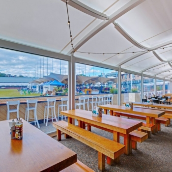 Covered outdoor seating area by Shade To Order - Restaurant shade structure - Sydney