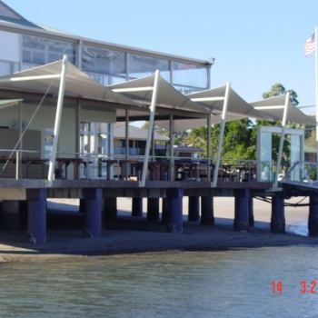 Triangle shade sails over deck by Shade to Order, Newcastle, Sydney, Central Coast, Nelson Bay