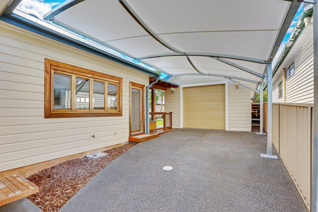 Carport shade sail for residential home by Shade to order, Gateshead, NSW