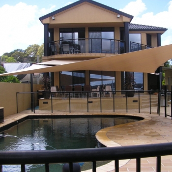 Designed shade sails over pool area by Shade to Order, Newcastle, Central Coast, NSW