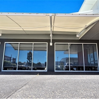 Carport shade sail for commercial project designed by Shade To Order, Newcastle, Charlestown, Thornton, NSW